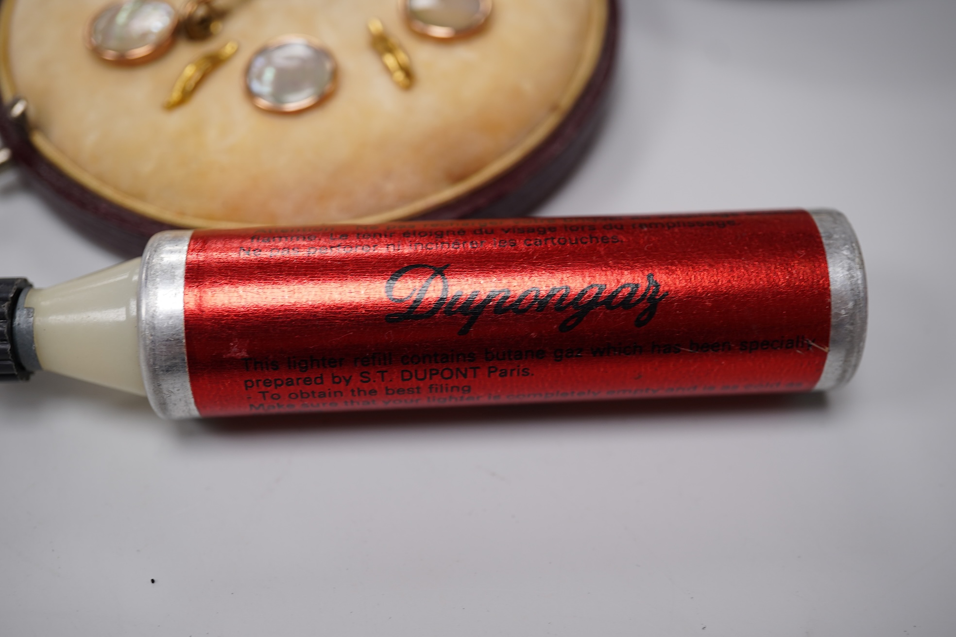Sundry items comprising two Dupont and Dunhill lighters and cased gold and a set of cased pearl dress studs